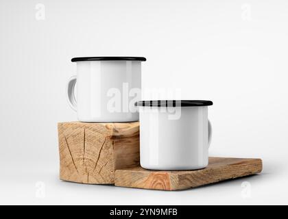 Maquette de deux tasses en émail blanc avec jante noire, sur vieille poutre en bois, planche, tasses en métal pour le tourisme, pour le design, l'image de marque, le motif. Modèle de tasse en fer pour Banque D'Images