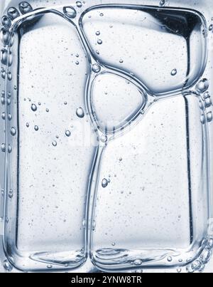 Gel cosmétique transparent sérum huile bulle texture Hyaluronic soin de la peau hydratant échantillon de produit avec bulles macro Banque D'Images