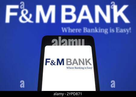 9 avril 2024, Brésil. Dans cette illustration photo, le logo F&M Bank est affiché sur l'écran d'un smartphone et en arrière-plan Banque D'Images