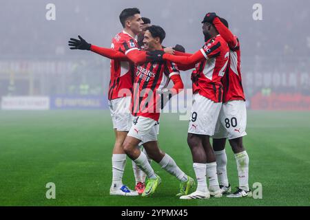 Milan, Italie. 30 novembre 2024. (C) Tijjani Reijnders de l'AC Milan célèbre avec ses coéquipiers après avoir marqué un but lors de la Serie A match de football 2024/25 entre l'AC Milan et l'Empoli FC au stade San Siro crédit : SOPA images Limited/Alamy Live News Banque D'Images