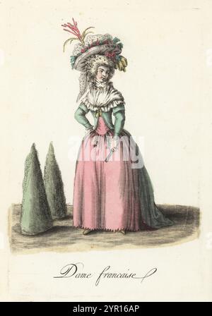 Mode d'une dame française, fin du XVIIIe siècle. Dans un grand bonnet décoré de fleurs et de plumes, cheveux en boucles et en anneaux, grand fichu, manteau d'équitation, jupons roses, deux montres FOB. Dame francaise. Gravure sur cuivre colorée à la main d’après une illustration de Jacques Grasset de Saint-Sauveur tirée des costumes civils actuels de tous les peuples connus, dessines d’apres nature, costumes civils actuels de tous les peuples connus, tirés de la nature, chez Pavard, Paris, 1788. Banque D'Images