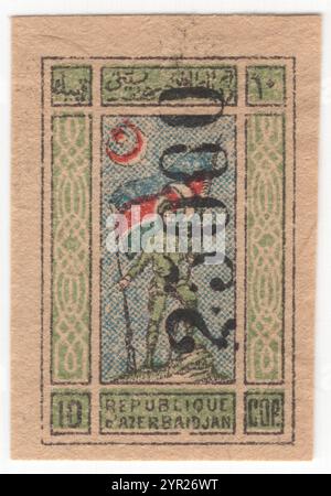 AZERBAÏDJAN — 1922 : 25000 roubles sur 10 kopecks timbre-poste multicolore de la République nationale représentant le porteur standard. Estampé à la main à partir de matrices métalliques dans une machine à numéroter. La République démocratique d'Azerbaïdjan a proclamé son indépendance de la République fédérative démocratique de Transcaucasie en 1918 et est devenue le premier État démocratique laïque à majorité musulmane. En 1920, le pays a été annexé à l'Union soviétique sous le nom de RSS d'Azerbaïdjan. Les timbres de l'Azerbaïdjan ont été remplacés en 1923 par ceux des Républiques fédérées de Transcaucasie Banque D'Images