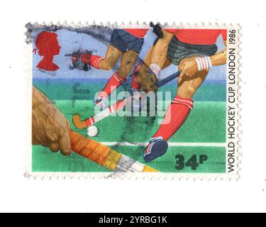 Timbre-poste vintage des Jeux du Commonwealth de 1986 de Grande-Bretagne représentant le hockey. Banque D'Images