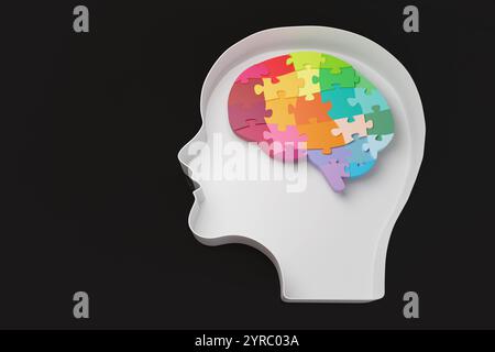 Puzzle de cerveau multicolore dans un récipient en forme de tête humaine sur fond noir. Intelligence, mentalité, psychologie, état d'esprit et fonctionnement du cerveau Banque D'Images