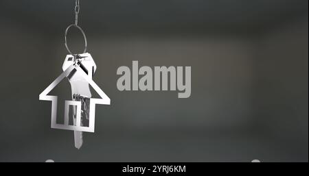 Porte-clés en forme de maison avec des clés suspendues, image sur fond flou Banque D'Images