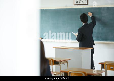 Les enseignants qui enseignent étudient en classe Banque D'Images