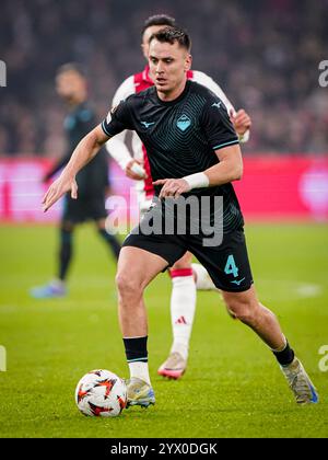 Amsterdam, pays-Bas. 12 décembre 2024. AMSTERDAM, PAYS-BAS - 12 DÉCEMBRE : Patric of SS Lazio court avec le ballon lors du match UEFA Europa League 2024/25 League phase MD6 entre l'AFC Ajax et le SS Lazio au Johan Cruijff Arena le 12 décembre 2024 à Amsterdam, pays-Bas. (Photo par Andre Weening/Orange Pictures) crédit : Orange pics BV/Alamy Live News Banque D'Images