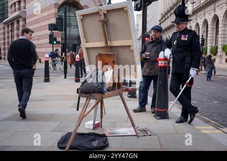 Portant la tenue de cérémonie de l'honorable compagnie d'artillerie, Dominic Reid OBE, admire le progrès d'une peinture de l'artiste Rob Pointon, une commission qui célèbre le centenaire de la compagnie de pikemen et de mousquetaires de l'honorable Artillery's Company, le 18 décembre 2024, dans la ville de Londres, en Angleterre. Dominic Reid OBE était PDG des Jeux Invictus et est l’actuel Pageantmaster du Lord Mayor’s Show. Au cours de sa carrière, il a occupé les postes de directeur du programme du 350e anniversaire de la Royal Society, de directeur exécutif de la Oxford & Cambridge Boat Race et de Londres Banque D'Images