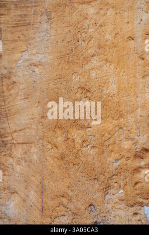 Mur de plâtre coloré en terre cuite, fond ou texture rustique, texture de mur grunge Banque D'Images