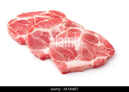 Trois steaks de viande de porc frais crus isolés sur blanc Banque D'Images