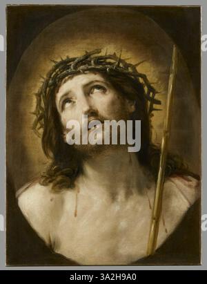 Dans ce tableau, Guido Reni présente le Christ avec un roseau, une interprétation de la scène Ecce Homo, où Jésus est représenté couronné d'épines. L'expression sombre et l'éclairage dramatique évoquent la souffrance du Christ. Banque D'Images