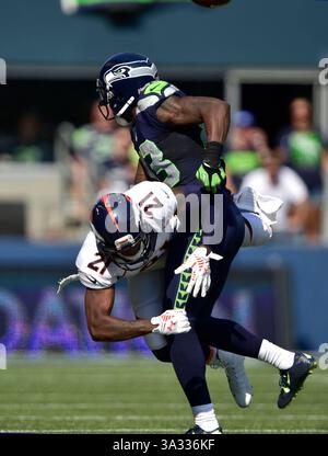 21 septembre 2014..Denver Broncos cornerback Aqib Talib #21 est appelé pour l'interférence de passe contre le Seattle Seahawks Wide récepteur Ricardo Lockette #83 au CenturyLink Field à Seattle, WA..Seahawks vaincre les Broncos 26 - 20 en prolongation. George Holland / Cal Sport Media. (Crédit image : © George Holland/Cal Sport Media/ZUMAPRESS.com) Banque D'Images