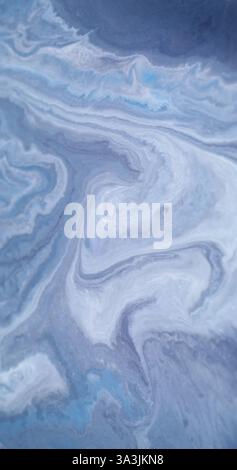 Pigment acrylique. Encre ondulée. Texture de marbre de couleur bleue défocalisée taches humides particules vague d'eau coulant sur fond d'art abstrait. Banque D'Images