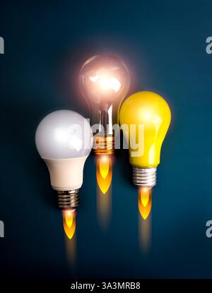 Démarrage d'entreprise, idée créative, connaissance de l'éducation, concept d'innovation. trois ampoules, jaunes, blanches et claires, comme vaisseau spatial ou fusée lancer l'esprit Banque D'Images