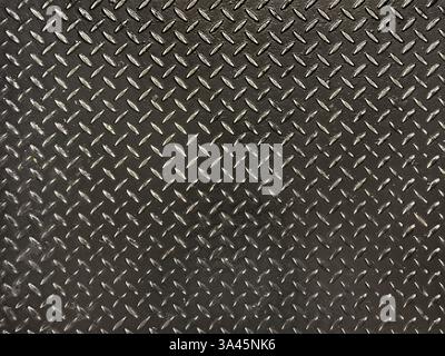 Gros plan de la plaque dameuse ou de la plaque de seuil en métal noir. Texture de fond de plaque de roulement sans couture Banque D'Images
