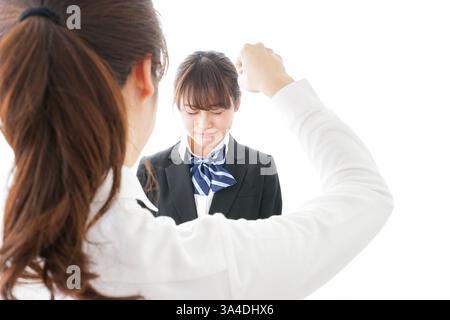 Les élèves se mettent en colère contre leur professeur Banque D'Images