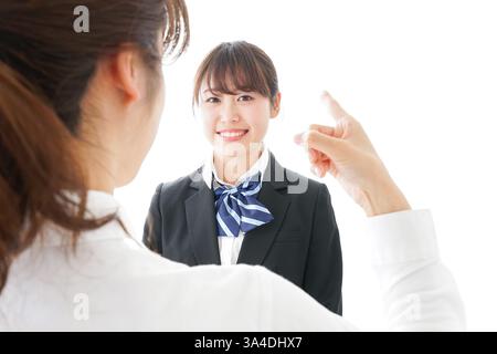 Les élèves se mettent en colère contre leur professeur Banque D'Images