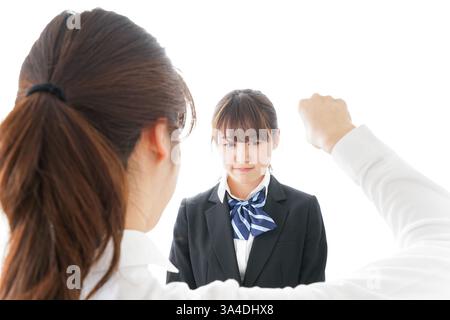Les élèves se mettent en colère contre leur professeur Banque D'Images