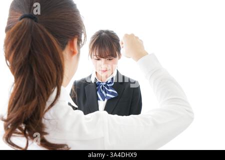 Les élèves se mettent en colère contre leur professeur Banque D'Images