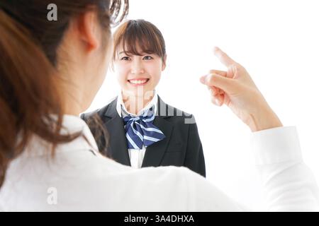 Les élèves se mettent en colère contre leur professeur Banque D'Images