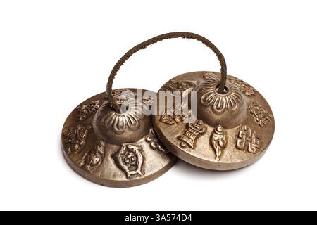 Cymbales bouddhistes tibétains isolés Banque D'Images