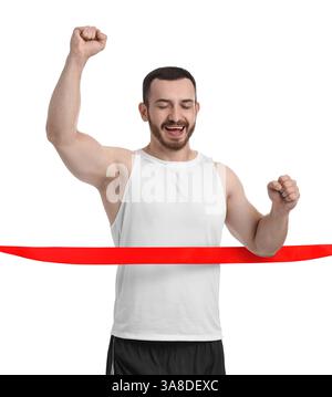 Heureux sportif traversant le ruban de ligne de finition rouge sur fond blanc Banque D'Images