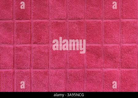 Gros plan texturé de tissu à motif carré rose Banque D'Images