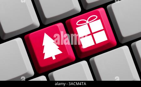 Clavier d'ordinateur avec symbole d'arbre de Noël et cadeau de Noël - Rechercher et commander des cadeaux de Noël en ligne sur Internet Banque D'Images
