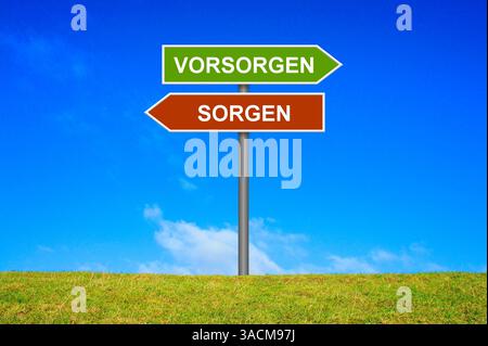 Panneau de signalisation sur une prairie verte pointe dans la direction des provisions et des soucis Banque D'Images