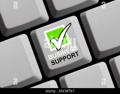 Le clavier d'ordinateur avec un symbole de coche indique le support professionnel Banque D'Images