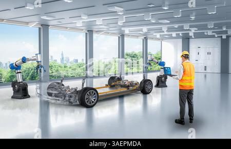 Ingénieur asiatique ou technicien travaillent avec l'usine d'automobile d'automatisation de voiture ev avec fond de verdure Banque D'Images