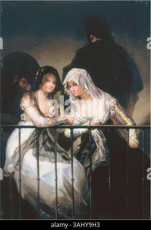 *Majas al balcon*, attribué à Francisco Goya, représente deux femmes en robe espagnole traditionnelle debout sur un balcon. La peinture reflète le style de Goya dans la capture de scènes sociales. Banque D'Images
