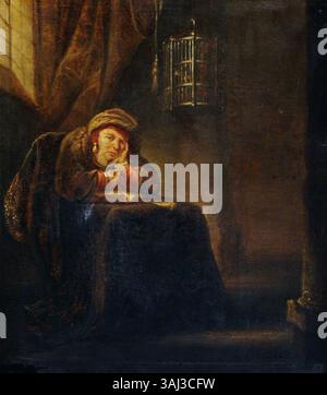 Un tableau intitulé 'Un chercheur assis à une table', créé entre 1700 et 1799, attribué à un imitateur de Rembrandt van Rijn. L'œuvre, rendue à l'huile sur panneau, représente un érudit assis à une table, qui fait partie de la collection du National Trust. Banque D'Images