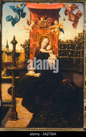 Cette huile sur panneau peinte vers 1480 par Jan Provoost représente la Vierge et l'enfant avec des anges, faisant partie d'un diptyque. Il comprend un vase avec des fleurs sur le revers. L'œuvre est conservée au Collegio Alberoni à Piacenza, en Italie. Banque D'Images