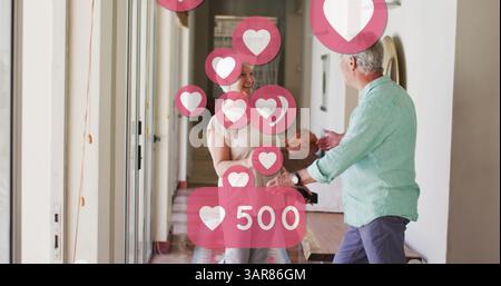 Image d'icônes de cœur de médias sociaux avec des chiffres sur la danse de couple senior Banque D'Images