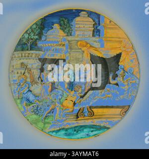 Une scène vibrante représentant des personnages engagés dans diverses activités, entouré d'une architecture ornée et de paysages luxuriants. La composition met en scène des musiciens, des danseurs et des éléments mythologiques, créant un récit riche rempli d'énergie et de mouvement. Assiette avec Isaac bénissant Jacob, 1540/1545, Atelier de Guido di Merlino, (italien, actif vers 1523-64), Urbino, faïence émaillée (maiolica), diamètre : 24,5 cm (9 5/8 po) Art classique avec une touche moderne réinventé par Artotop Banque D'Images