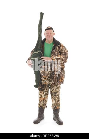 Pêche pêcheur avec rod standing in studio isolé sur fond blanc Banque D'Images