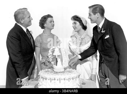 PHOTO DE FICHIER - ELIZABETH TAYLOR, 79 ans, la déesse du cinéma primée aux Oscars et militante pionnière du sida dont les mariages hors écran, les divorces et les exploits défiant la mort rivalisent avec ses films pour le drame est mort le 23 mars 2011 d'une insuffisance cardiaque congestive. PHOTO : SORTIE : 16 juin 1950 - titre original du film : Père de la mariée. SUR LA PHOTO : SPENCER TRACY dans le rôle de Stanley T. Banks, JOAN BENNETT dans celui d'Ellie Banks, ELIZABETH TAYLOR dans celui de Kay Banks et DON TAYLOR dans celui de Buckley Dunstan. (Crédit image : © Entertainment Pictures/ZUMAPRESS.com) Banque D'Images