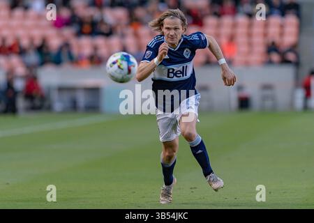 12 mars 2022, Houston, Texas, États-Unis : Florian Jungwirth (26 ans), milieu de terrain des Whitecaps de Vancouver, court après le ballon lors du match entre le Houston Dynamo FC et le Vancouver Whitecaps FC au PNC Stadium de Houston, Texas, le 12 mars 2022. Houston Dynamo FC remporte la première victoire de la saison en 2-1 contre Vancouver. (Crédit image : © Lynn Pennington/ZUMA Press Wire) Banque D'Images