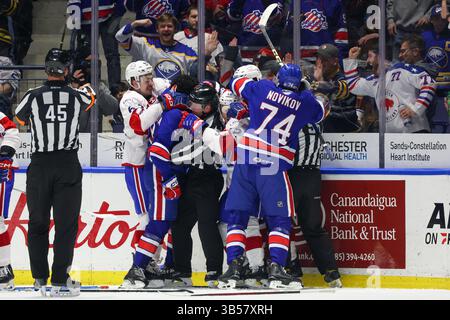 Rochester, New York, États-Unis. 11 avril 2025. Les Américains de Rochester et les joueurs de Laval Rocket se battent en première période. Les Américains de Rochester ont accueilli la Rocket de Laval lors de la soirée du Temple de la renommée en l’honneur de Ryan Miller lors d’un match de la Ligue américaine de hockey au Blue Cross Arena de Rochester, New York. (Jonathan Tenca/CSM). Crédit : csm/Alamy Live News Banque D'Images