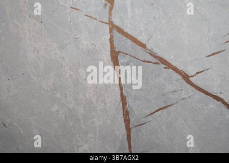 Vue rapprochée de la texture du marbre avec des veines dorées en pierre naturelle Banque D'Images