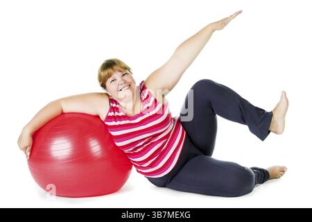 Grosse femme avec une grosse boule cardan rouge Banque D'Images