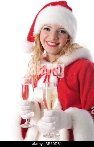 Joyeuse santa girl avec des verres de champagne. Mise au point sélective. Carte de voeux de Noël Banque D'Images