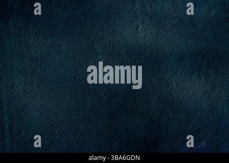 Un fond texturé sombre visuellement captivant avec des nuances de bleu profond et de noir. Parfait pour une utilisation dans des conceptions, des présentations, ou comme un s dramatique Banque D'Images
