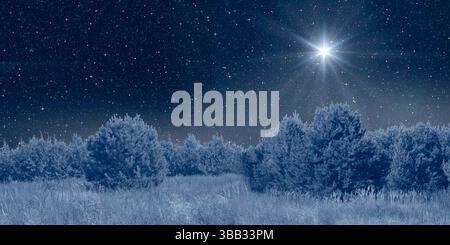 L'étoile brillante brille au-dessus de la crèche de noël de Jésus-Christ sur la nuit ciel étoilé Banque D'Images