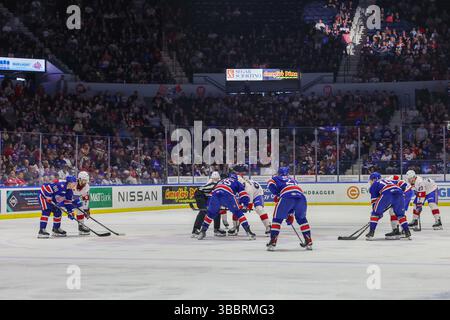 Rochester, New York, États-Unis. 16 mai 2025. Les Américains de Rochester et les joueurs de Laval Rocket s'affrontent en première période. Les Américains de Rochester ont accueilli le Rocket de Laval lors du deuxième match de la finale de la Ligue américaine de hockey de la Division Nord au Blue Cross Arena de Rochester, New York. (Jonathan Tenca/CSM). Crédit : csm/Alamy Live News Banque D'Images