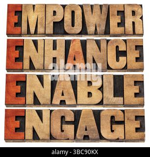 Responsabiliser, améliorer, permettre et engager - leadership motivationnel et concept commercial - un collage de mots isolés dans le type de bois typographique teinté par R. Banque D'Images