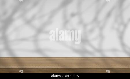 ombre des arbres se balançant doucement dans la brise, sur un fond blanc avec une table en bois. Banque D'Images