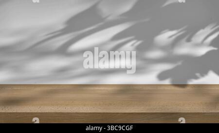 ombre des arbres se balançant doucement dans la brise, sur un fond blanc avec une table en bois. Banque D'Images