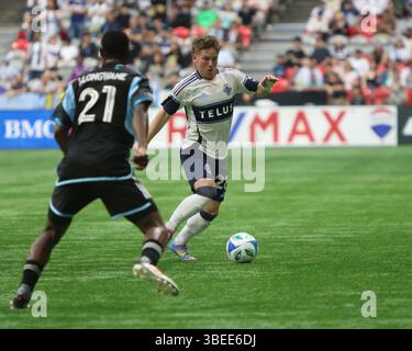 Vancouver, Canada. 28 mai 2025. VANCOUVER, BC - MAI 28 : le défenseur des Whitecaps de Vancouver Tate Johnson (28), l'attaquant Bongokuhle Hlongwane (21) du Minnesota United FC en action pour le match de saison régulière de la MLS Vancouver Whitecaps FC vs Minnesota United FC à BC place le 28 mai 2025 à Vancouver, Canada.(photo par Tomaz Jr/Pximages) crédit : PX images/Alamy Live News Banque D'Images